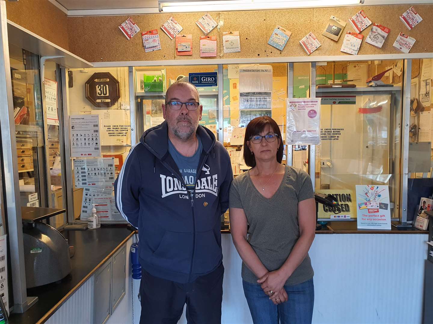 Fraser and Maria Lindsay at the post office counter in Dersingham